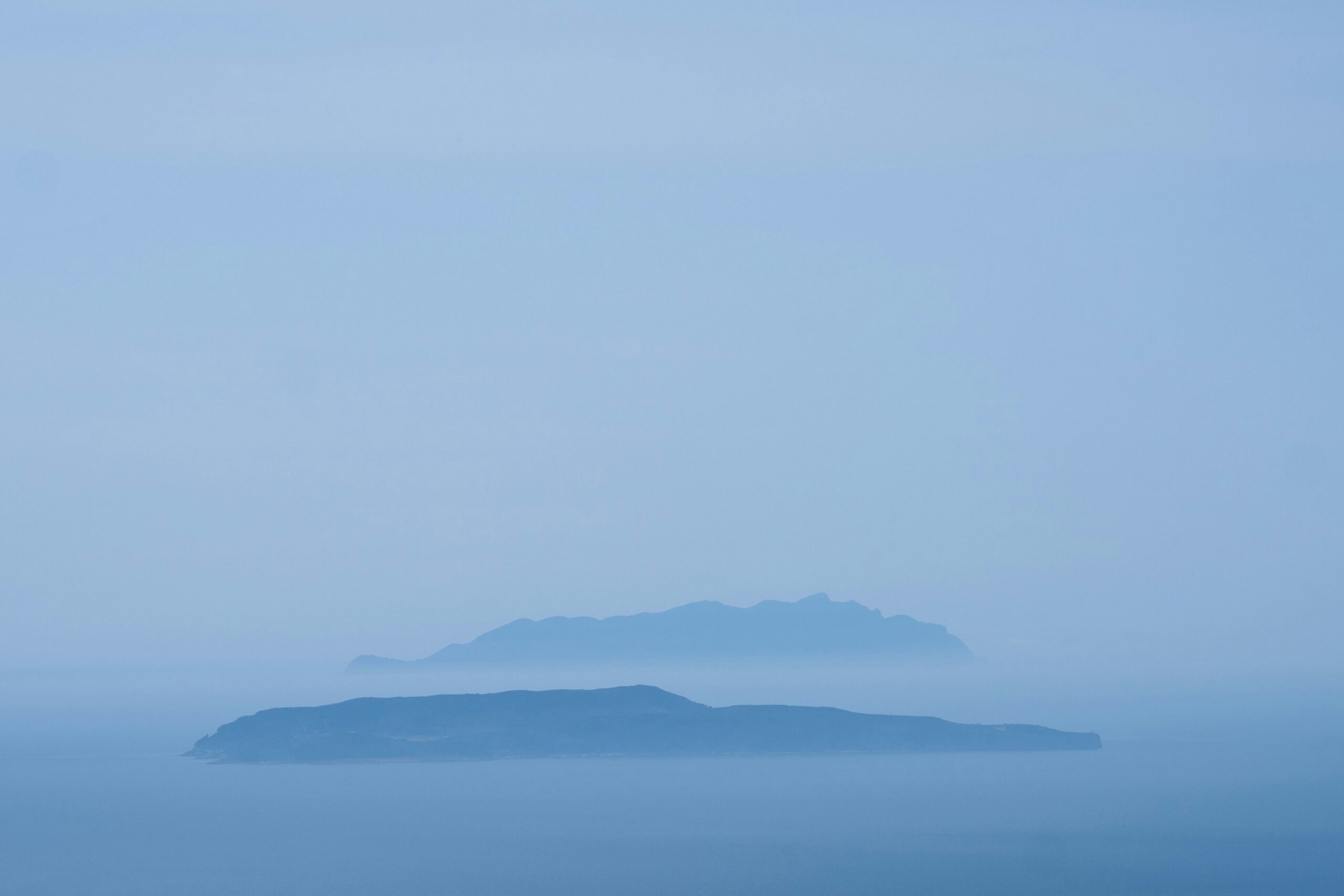 mountaintops poking up through clouds