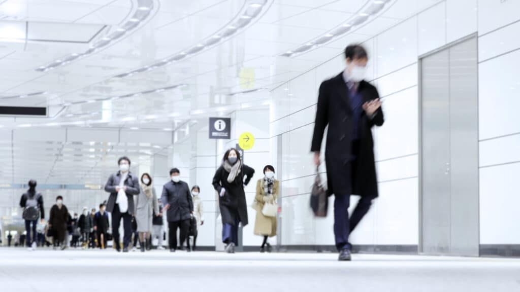 People wearing masks in Japanese airport.