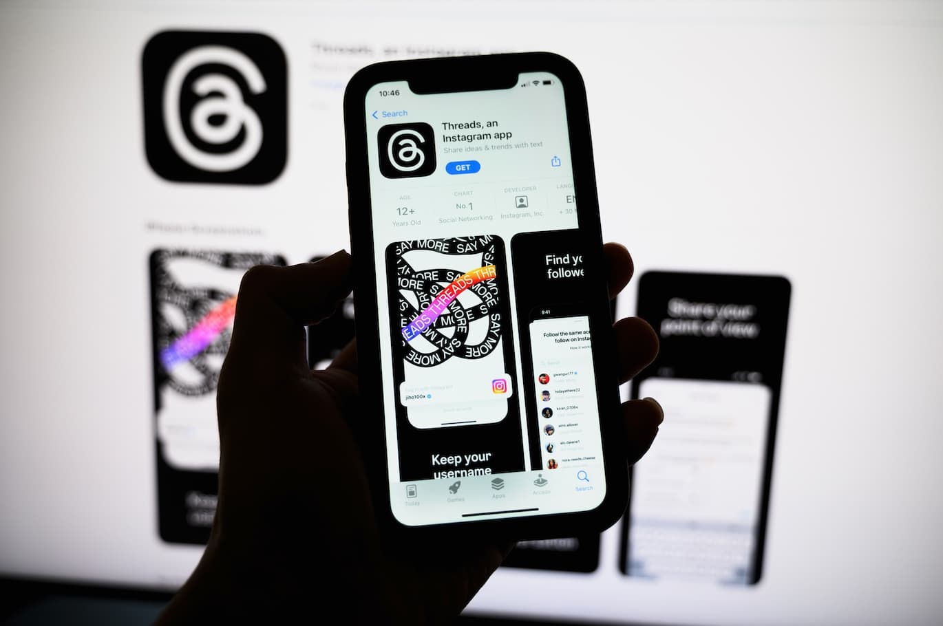 Photo of phone showing interface of Meta's Threads app