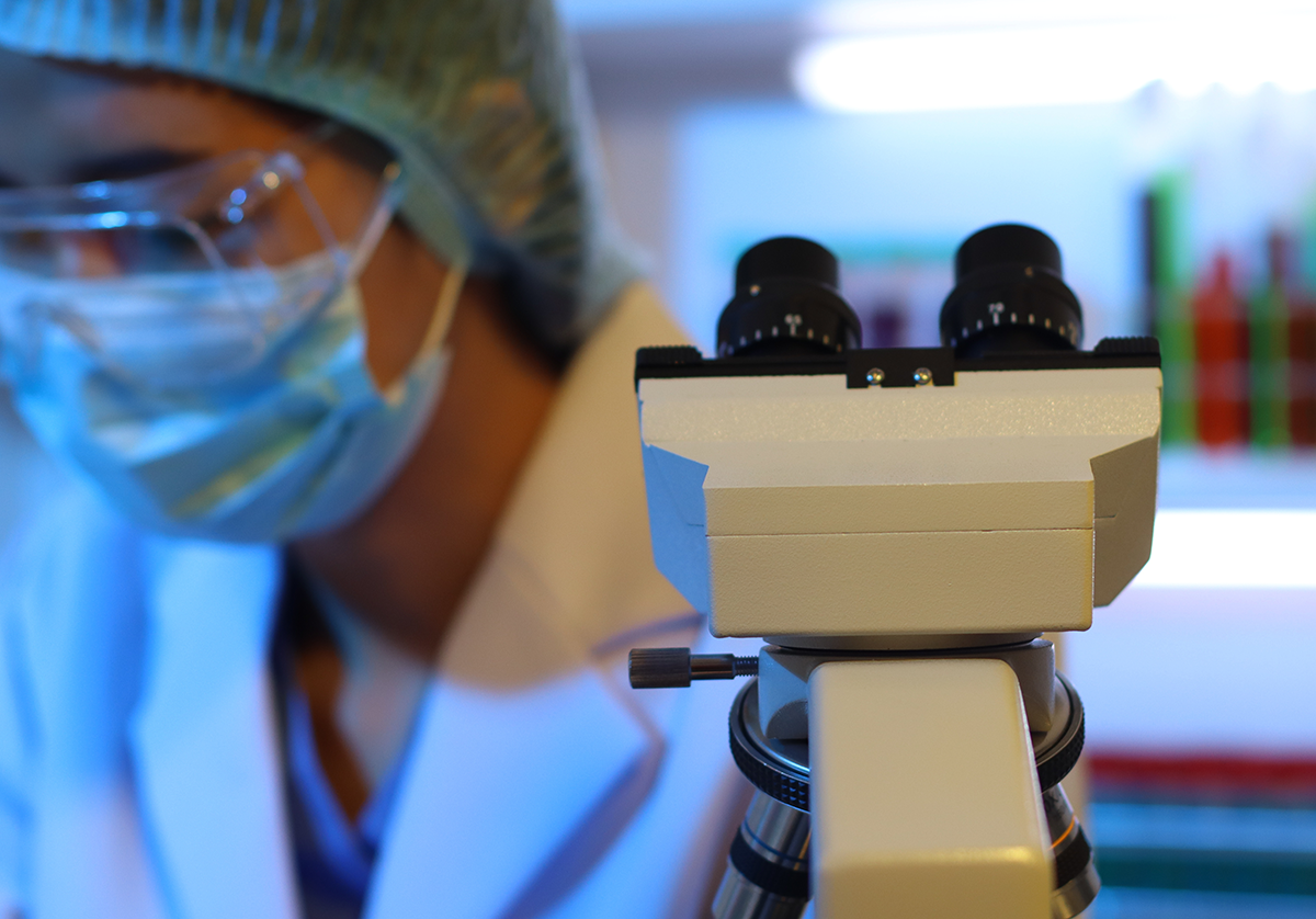 researcher and microscope