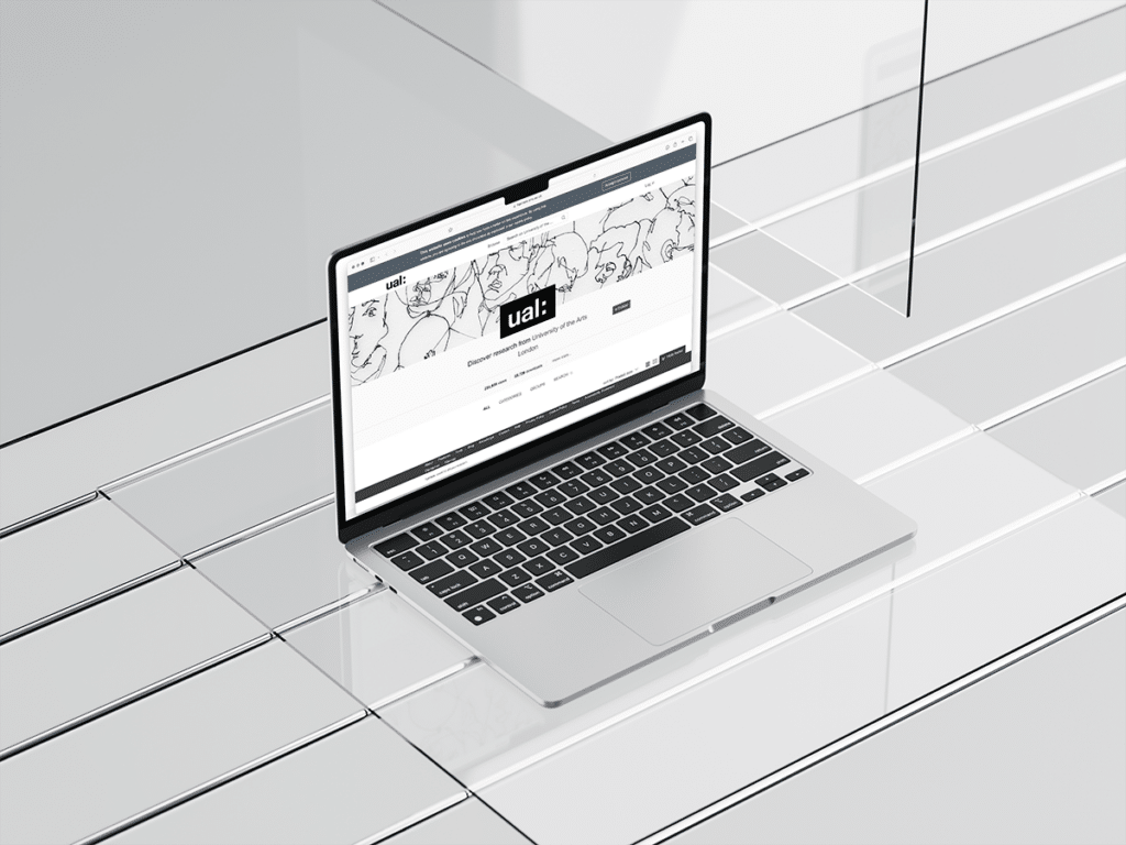 A laptop screen displaying a webpage with the title "UAL".